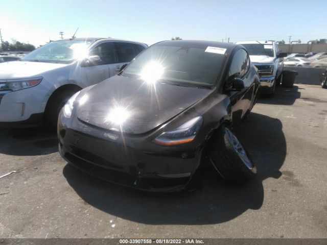 7SAYGDEE2NF447516  tesla model y 2022 IMG 1