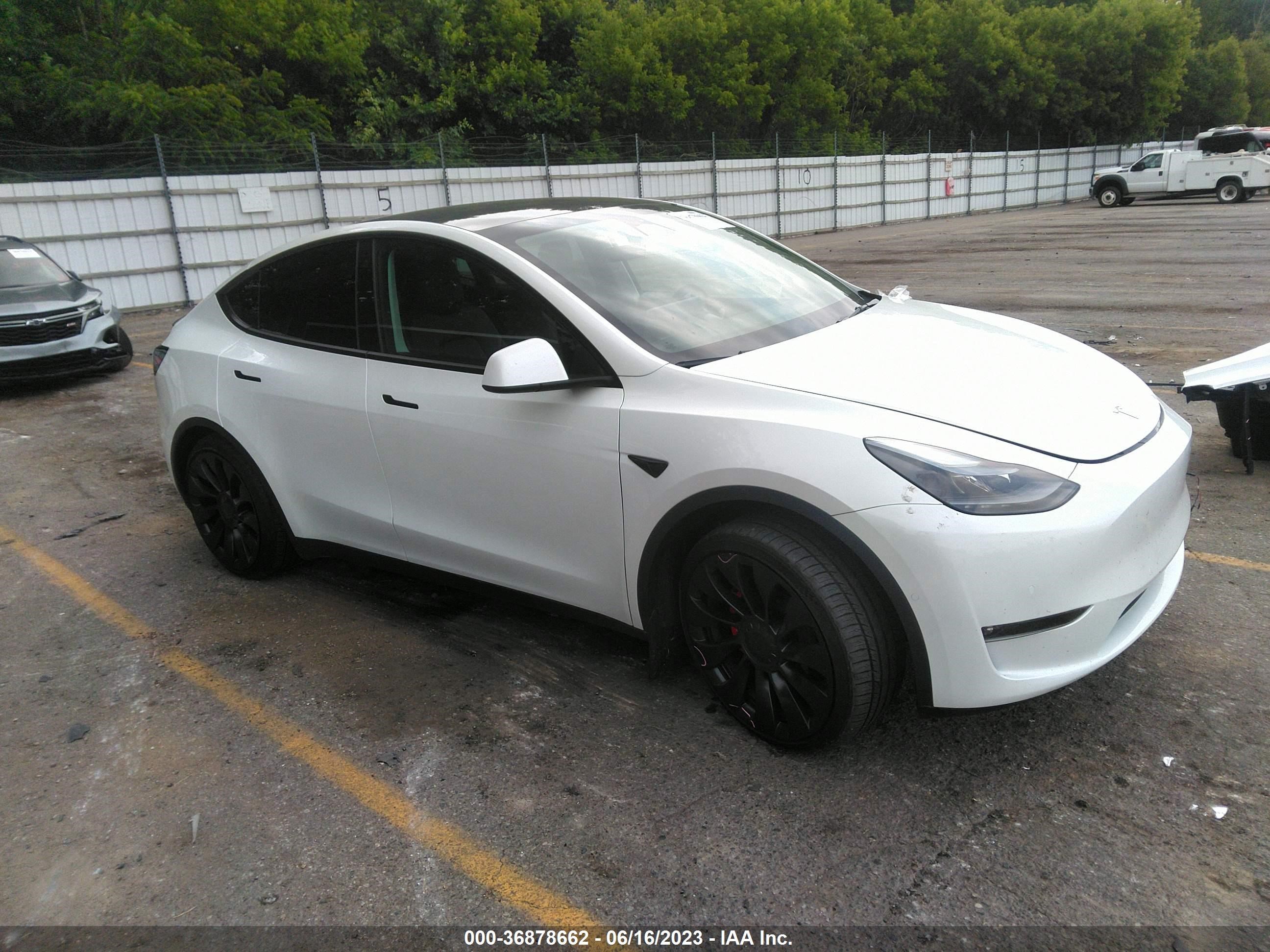 7SAYGDEF9NF543488  tesla model y 2022 IMG 0