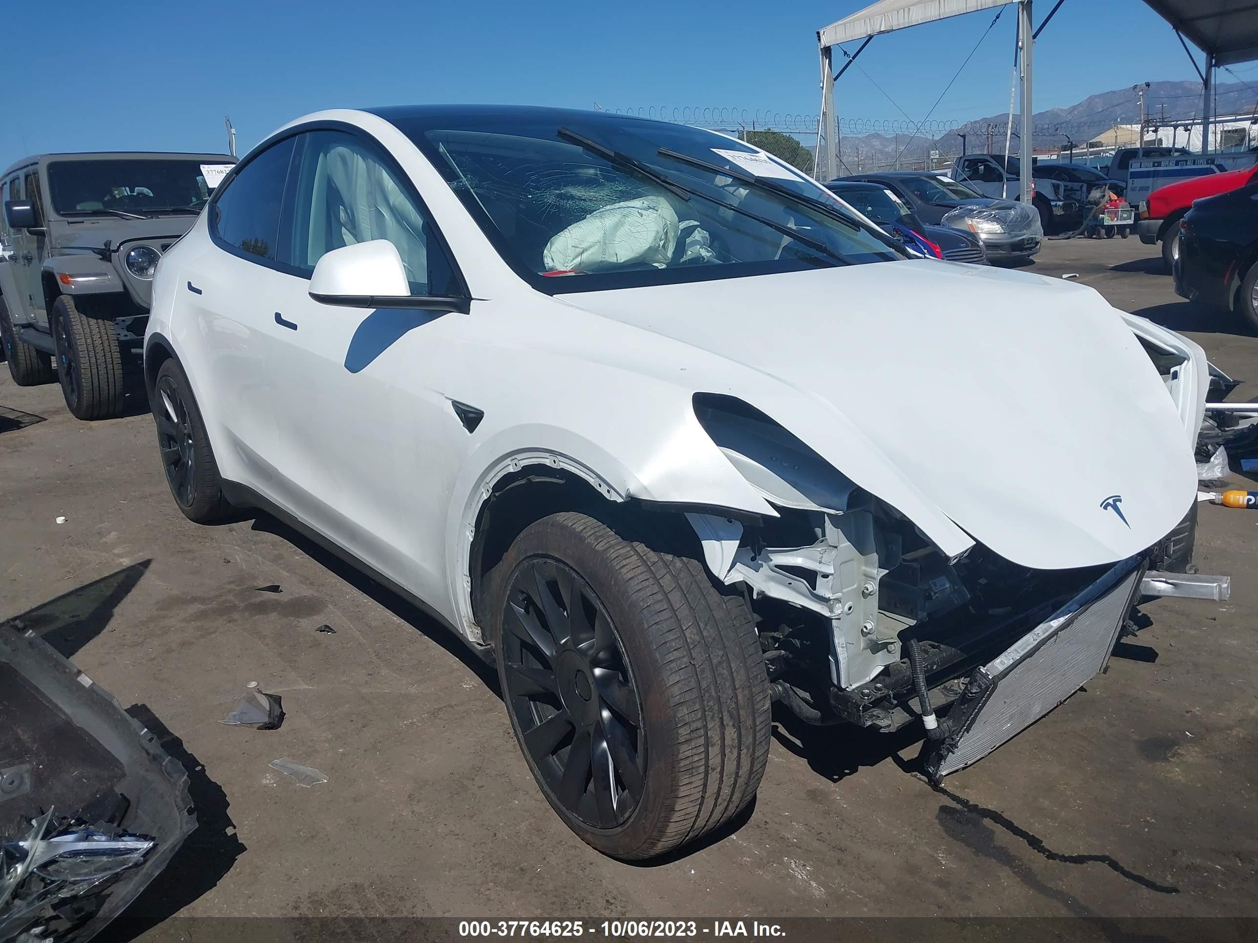 7SAYGDEE9PA059084  tesla model y 2023 IMG 0